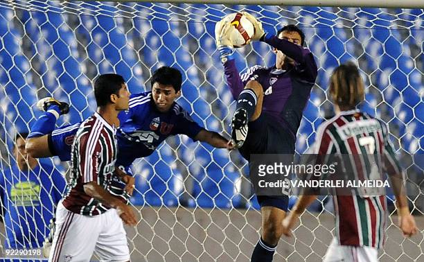 Goalkeeper Raphael of Brazilian Fluminense vies for the ball with Edson Puch of Chilean Universidad de Chile, during a Copa Sudamericana...
