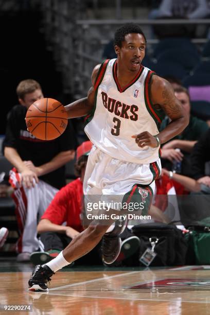 Brandon Jennings of the Milwaukee Bucks drives the ball upcourt against the Minnesota Timberwolves during the preseason game on October 17, 2009 at...