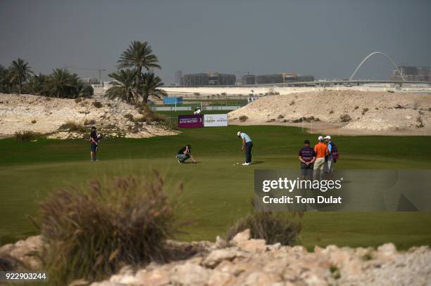 Oliver Fisher of England putts on the 16th green during the first round of the Commercial Bank Qatar Masters at Doha Golf Club on February 22, 2018...