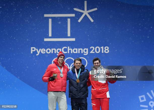 Silver medalist Ramon Zenhaeusern of Switzerland, gold medalist Andre Myhrer of Sweden and bronze medalist Michael Matt of Austria celebrate during...