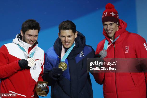 Bronze medalist Michael Matt of Austria, gold medalist Andre Myhrer of Sweden and silver medalist Ramon Zenhaeusern of Switzerland celebrate during...