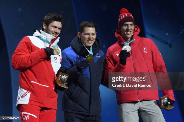 Bronze medalist Michael Matt of Austria, gold medalist Andre Myhrer of Sweden and silver medalist Ramon Zenhaeusern of Switzerland celebrate during...