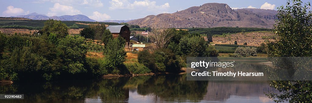 Okanogan River with orchards, farm buildings