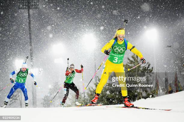 Mona Brorsson of Sweden, Lena Haecki of Switzerland and Kaisa Makarainen of Finland compete during the Women's 4x6km Relay on day 13 of the...