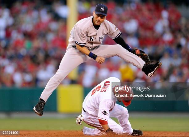 Derek Jeter of the New York Yankees forces Jeff Mathis of the Los Angeles Angels of Anaheim out at second base during the second inning in Game Five...