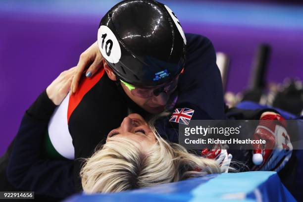 Shaolin Sandor Liu of Hungary embraces his girlfriend Elise Christie of Great Britain following the Short Track Skating Men's 5000m Relay Final A on...