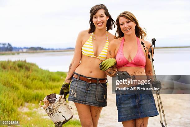 girls picking up litter in wetlands - petaluma stock pictures, royalty-free photos & images