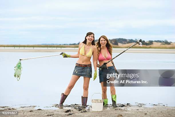 girls pick up trash in lake - petaluma stock pictures, royalty-free photos & images