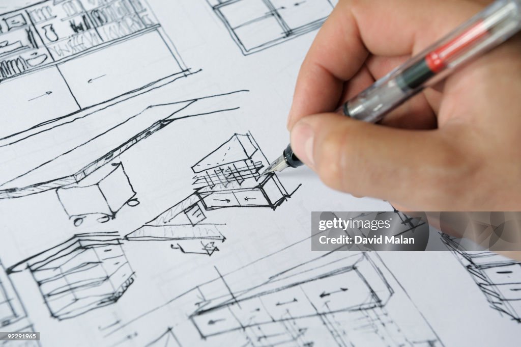 Architects hand sketching interior plans