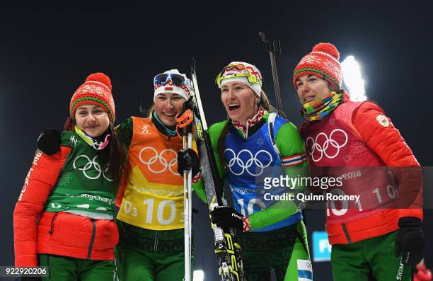 Iryna Kryuko, Dzinara Alimbekava, Darya Domracheva and Nadezhda Skardino of Belarus celebrate winning gold after the Women's 4x6km Relay on day 13 of...