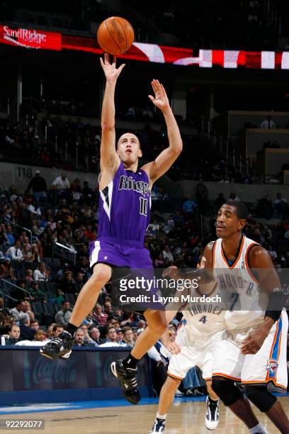 Sergio Rodriguez of the Sacremento Kings shoots a jump shot against Kevin Ollie of the Oklahoma City Thunder on October 22, 2009 at the Ford Center...