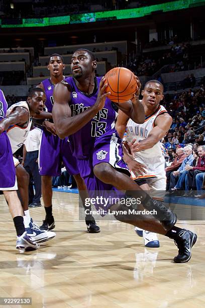 Tyreke Evans of the Sacremento Kings dribbles past Russell Westbrook of the Oklahoma City Thunder on October 22, 2009 at the Ford Center in Oklahoma...