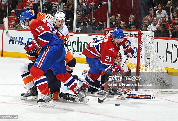 Brian Gionta of the Montreal Canadiens waits for the rebound with teammate Mike Cammalleri against the New York Islanders on October 22, 2009 at the...