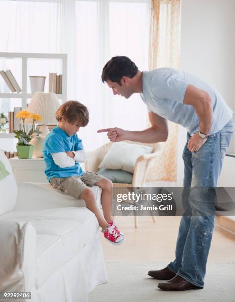 father disciplining son - criticised stock pictures, royalty-free photos & images