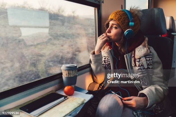 traveler on a journey with train - girl train window stock pictures, royalty-free photos & images