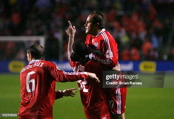 Brandon Prideaux, Dasan Robinson and Cuauhtemoc Blanco of the Chicago Fire celebrate after Chivas USA scored an own goal after a Blanco corner kick...