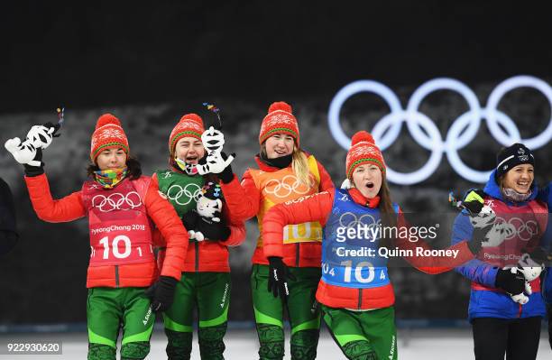 Gold medalists Nadezhda Skardino, Iryna Kryuko, Dzinara Alimbekava and Darya Domracheva of Belarus celebrate on the podium during the victory...