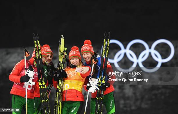 Gold medalists Nadezhda Skardino, Iryna Kryuko, Dzinara Alimbekava and Darya Domracheva of Belarus take a selfie photograph as they celebrate on the...