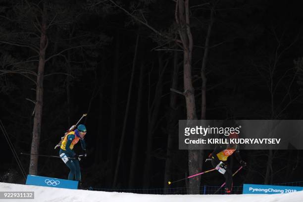 Germany's Franziska Hildebrand and Ukraine's Yuliia Dzhima compete in the women's 4x6km biathlon event during the Pyeongchang 2018 Winter Olympic...
