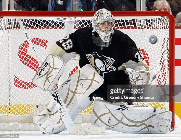 Marc-Andre Fleury of the Pittsburgh Penguins watches an oncoming shot against the St. Louis Blues on October 20, 2009 at Mellon Arena in Pittsburgh,...