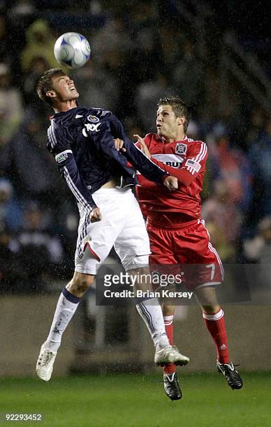 Logan Pause of the Chicago Fire and Justin Braun of Chivas USA go for the ball during the second half at Toyota Park on October 22, 2009 in...