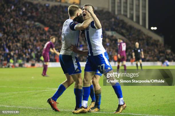 Will Grigg of Wigan celebrates with teammate Ryan Colclough of Wigan after scoring their 1st goal during The Emirates FA Cup Fifth Round match...