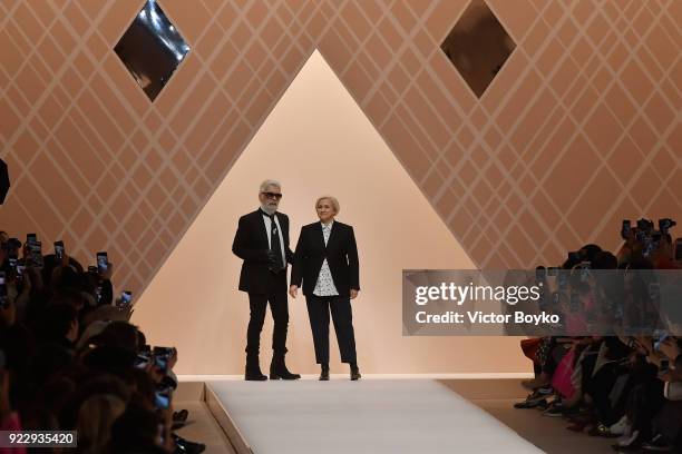 Designers Karl Lagerfeld and Silvia Venturini Fendi acknowledge the applause of the audience runway at the Fendi show during Milan Fashion Week...