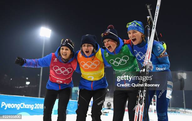 Bronze medalists Anais Chevalier, Justine Braisaz, Mona Brorsson and Anais Bescond of France celebrate after the Women's 4x6km Relay on day 13 of the...