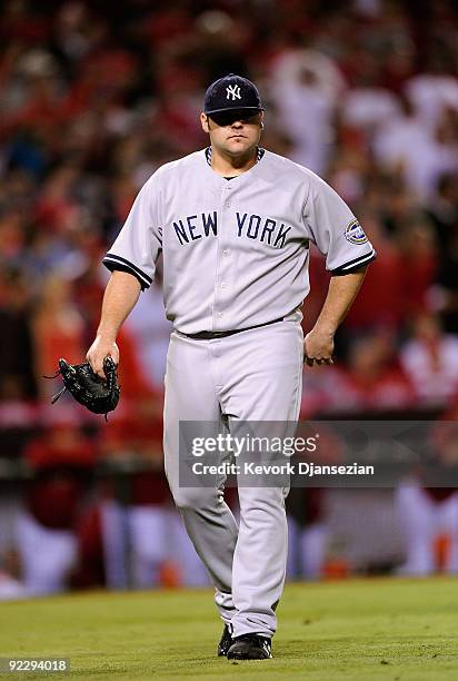 Joba Chamberlain of the New York Yankees leaves the mound after being relieved by teammate Mariano Rivera during the eighth inning in Game Five of...