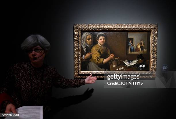 Guide gives explanations about the painting 'Christ in the house of Martha and Mary' by Spanish painter Diego Velezquez during a preview of the...