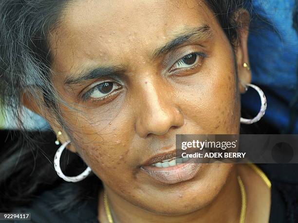 To go with Australia-Indonesia-immigration-refugees-SriLanka by Arlina Arshad Sri Lankan asylum-seeker Shanti talks to journalists from her boat...