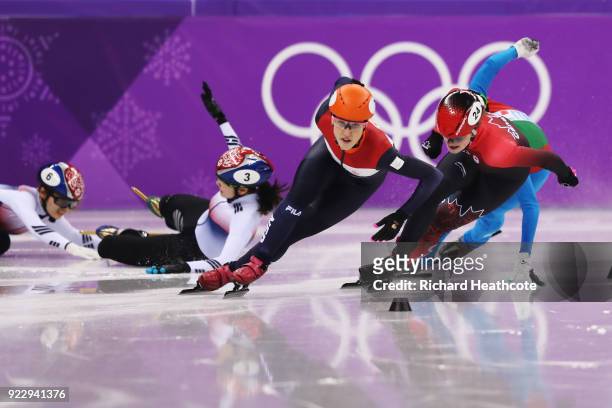 Suzanne Schulting of the Netherlands leads as Sukhee Shim and Minjeong Choi of Korea crash during the Short Track Speed Skating - Ladies' 1,000m...