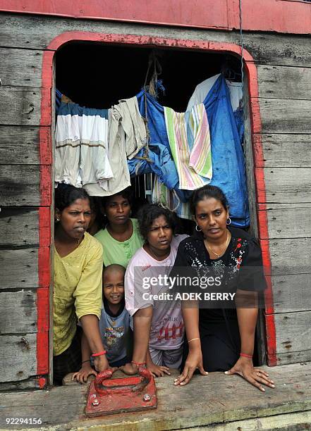 To go with Australia-Indonesia-immigration-refugees-SriLanka by Arlina Arshad Sri Lankan asylum-seeker Shanti talks to journalists from a boat moored...