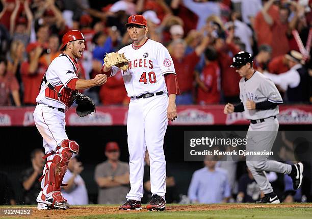 Brian Fuentes of the Los Angeles Angels of Anaheim celebrates with teammate Jeff Mathis after defeating the New York Yankees 7-6 in Game Five of the...