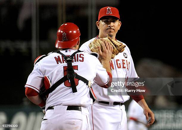 Brian Fuentes of the Los Angeles Angels of Anaheim celebrates with teammate Jeff Mathis after defeating the New York Yankees 7-6 in Game Five of the...