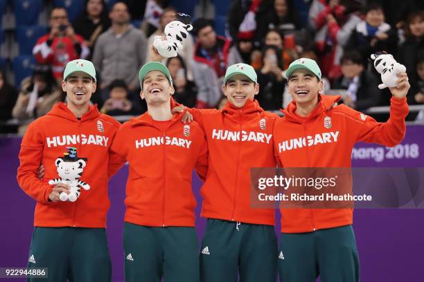 Gold medalists Shaoang Liu, Shaolin Sandor Liu, Viktor Knoch and Csaba Burjan of Hungary celebrate during the victory ceremony after the Short Track...