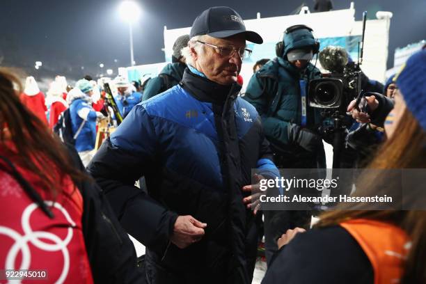 King Carl Gustaf of Sweden celebrates with silver medalist Linn Persson of Sweden after during the Women's 4x6km Relay on day 13 of the PyeongChang...