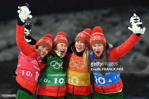 Belarus' Nadezhda Skardino, Belarus' Iryna Kryuko, Belarus' Dzinara Alimbekava and Belarus' Darya Domracheva celebrate winning gold during the...