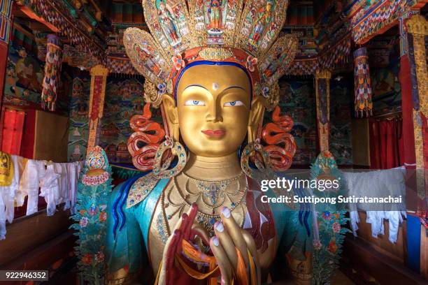 beautiful and respectful golden buddha statue in thiksey monastery temple , leh-ladakh , india - buddha face stock-fotos und bilder