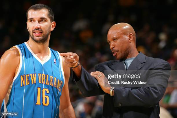 Peja Stojakovic of the New Orleans Hornets has a talk with his coach Byron Scott against the Golden State Warriors on October 22, 2009 at Oracle...