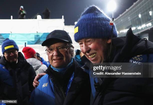 King Carl Gustaf of Sweden celebrates with head coach Wolfgang Pichler after the Women's 4x6km Relay on day 13 of the PyeongChang 2018 Winter Olympic...