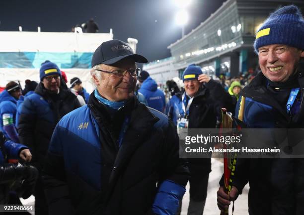 King Carl Gustaf of Sweden celebrates with head coach Wolfgang Pichler after the Women's 4x6km Relay on day 13 of the PyeongChang 2018 Winter Olympic...