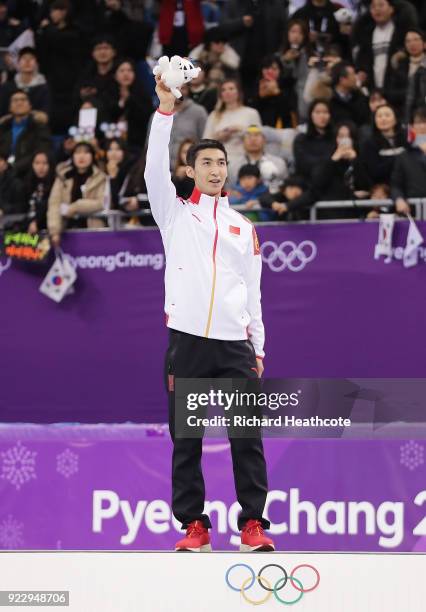 Gold medalist Dajing Wu of China celebrates during the victory ceremony after the Short Track Speed Skating Men's 500m Final on day thirteen of the...