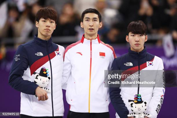 Silver medalist Daeheon Hwang of Korea, gold medalist Dajing Wu of China and bronze medalist Hyojun Lim of Korea stand on the podium during the...