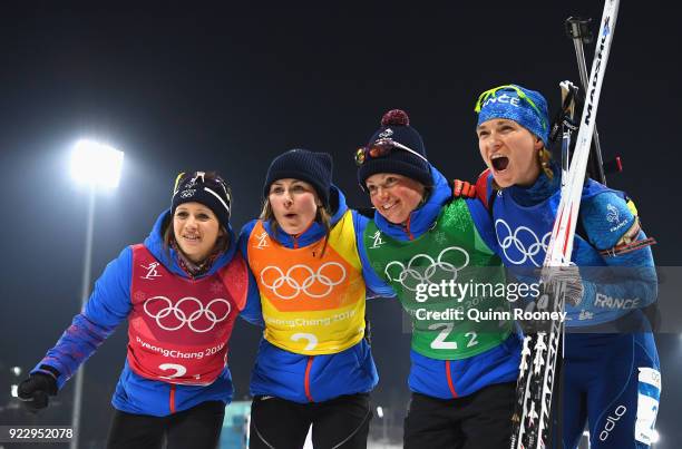 Bronze medalists Anais Chevalier, Justine Braisaz, Marie Dorin Habert and Anais Bescond of France celebrate after the Women's 4x6km Relay on day 13...