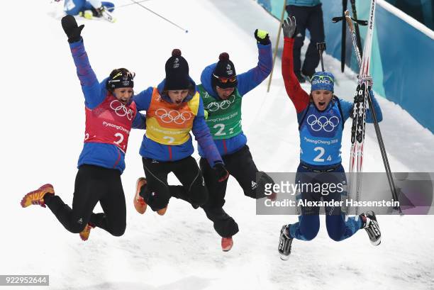 Bronze medalists Anais Chevalier, Justine Braisaz, Marie Dorin Habert and Anais Bescond of France celebrate after the Women's 4x6km Relay on day 13...