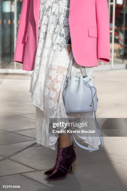 Digital Influencer Vicky Lee wears a Theory coat and jumper, Baum und Pferogarten dress, Julia Mays boots and an Alexandra De Curtis bag on day 2 of...