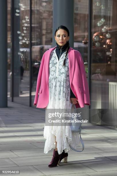 Digital Influencer Vicky Lee wears a Theory coat and jumper, Baum und Pferogarten dress, Julia Mays boots and an Alexandra De Curtis bag on day 2 of...