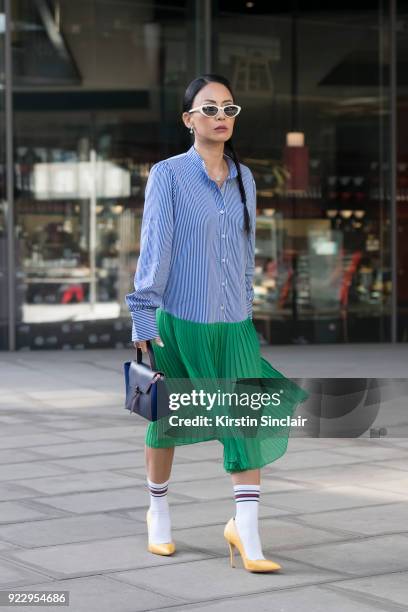 Digital Influencer Vicky Lee wears a Baum und Pferogarten dress, Julia Mays shoes, Black eyewear sunglasses and an Alexandra De Curtis bag on day 2...