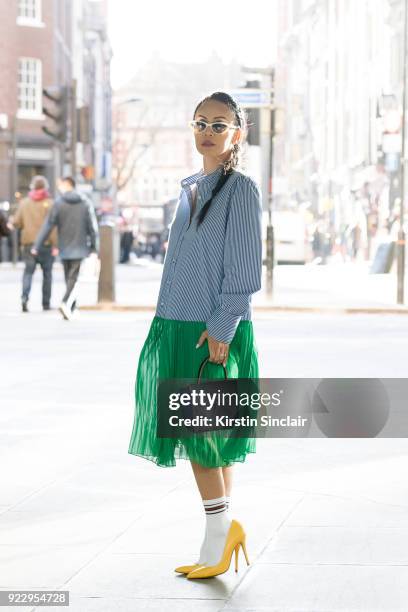 Digital Influencer Vicky Lee wears a Baum und Pferogarten dress, Julia Mays shoes, Black eyewear sunglasses and an Alexandra De Curtis bag on day 2...